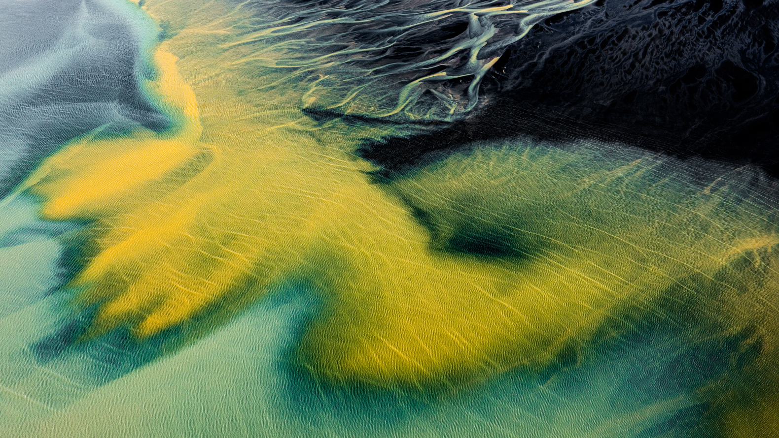 Digital 3D terrain visualization with green, yellow and blue wireframe contours representing elevation and depth.
