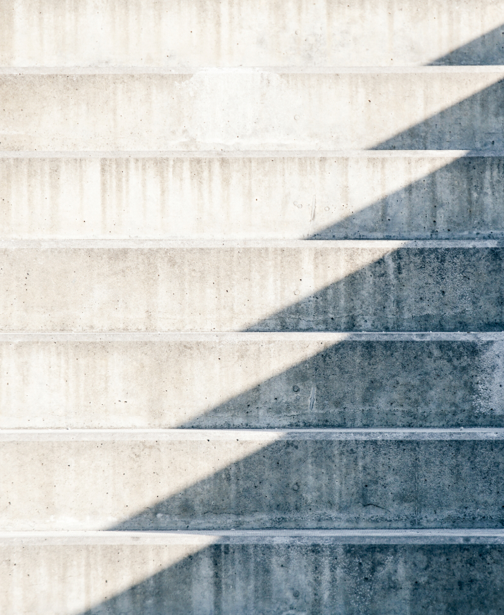 Photography of a road in the middle of a snow landscape with the moon in the sky.