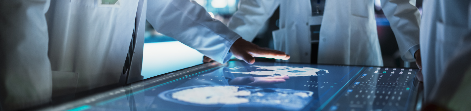Image with doctors putting their hands on screen
