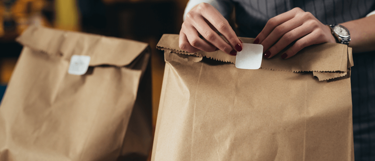 A woman wraps up a delivery