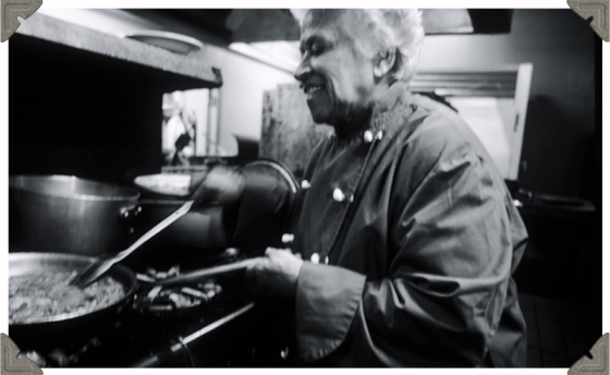 a picture of a chef cooking happily