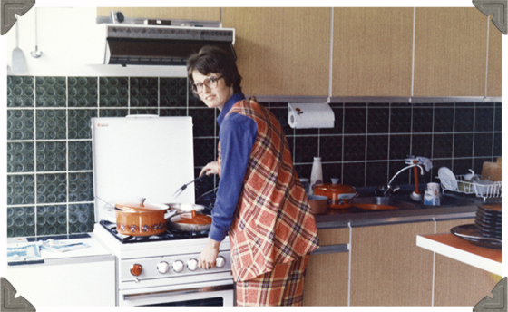 a picture of a woman cooking in the kitchen