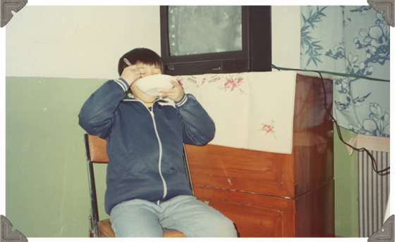 a picture of a boy eating his meal