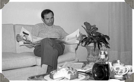 a picture of a man reading magazine in black and white