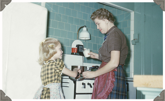 a picture of a mother and child cooking together in kitchen