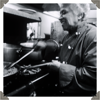 a picture of a chef cooking happily