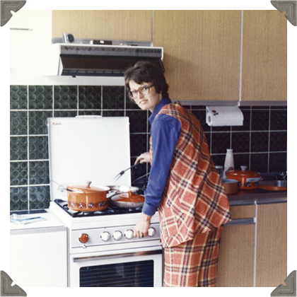 a picture of a woman cooking in the kitchen