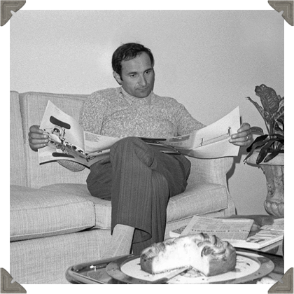 a picture of a man reading magazine in black and white