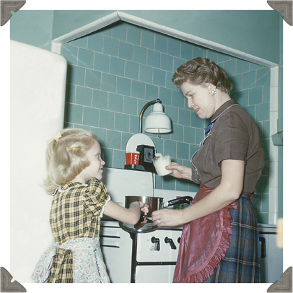 a picture of a mother and child cooking together in kitchen