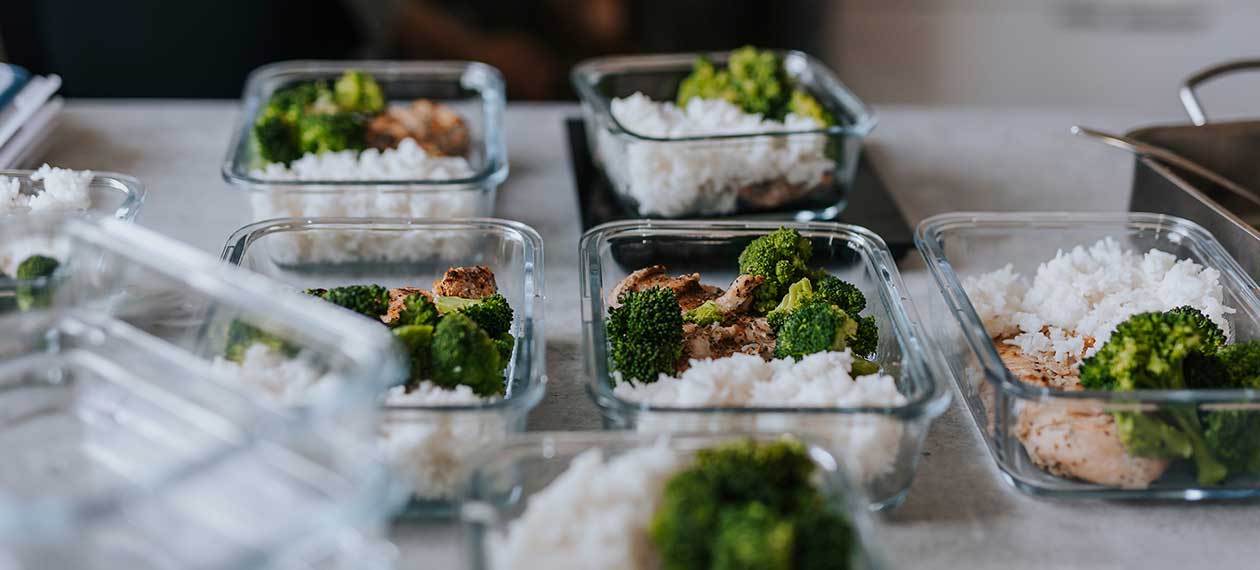 Bowls with rice and broccoli